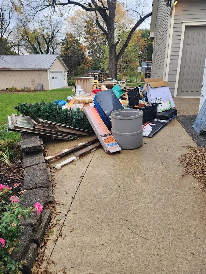 Dumpster being loaded with debris for 3 Yard Dumpster Rental in Marlborough
